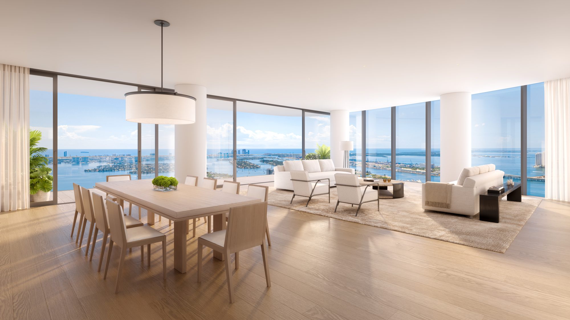 Great room and dining area over Biscayne Bay at EDITION Residences Miami Edgewater, developer rendering